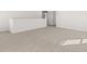 Bright open hallway with neutral carpet, leading to other areas of the house at 2717 Montie Ct, Lithia Springs, GA 30122