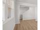 Bright living room features new wood-look flooring and staircase to the next level at 2717 Montie Ct, Lithia Springs, GA 30122