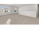Spacious carpeted loft area with abundant natural light from multiple windows offering neighborhood views at 2717 Montie Ct, Lithia Springs, GA 30122