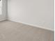 Comfortable room featuring neutral carpeting, ample space, and natural light at 2717 Montie Ct, Lithia Springs, GA 30122