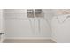 Bright walk-in closet with wire shelving and rods to hang your clothes at 112 Crooked Lake Park, Villa Rica, GA 30180