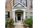 Charming front entrance with floral accents and covered porch at 11352 Musette Cir, Alpharetta, GA 30009