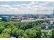 Beautiful aerial view showcasing trees, a stadium, and a skyline in the distance at 2442 Crescent Park Ct, Atlanta, GA 30339