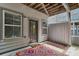 Cozy covered back patio with a colorful outdoor rug, offers outdoor living space at 2442 Crescent Park Ct, Atlanta, GA 30339