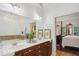 Bathroom with double sinks, vanity, and a large mirror, adjacent to the main bedroom at 2442 Crescent Park Ct, Atlanta, GA 30339