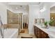 Spacious bathroom with a tub, shower, and dual sink vanity at 2442 Crescent Park Ct, Atlanta, GA 30339
