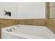 Corner bathtub with tile surround and modern fixtures in the bathroom at 2442 Crescent Park Ct, Atlanta, GA 30339
