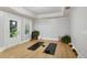 Bonus room features hardwood floors, plants, two yoga mats, and recessed ceiling at 2442 Crescent Park Ct, Atlanta, GA 30339