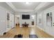 Spacious bonus room with hardwood floors, an entertainment center, and natural lighting at 2442 Crescent Park Ct, Atlanta, GA 30339