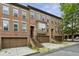 Beautiful brick townhomes with attached garages and landscaped front yards at 2442 Crescent Park Ct, Atlanta, GA 30339
