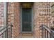 Welcoming front door with classic brick surround and stylish accents at 2442 Crescent Park Ct, Atlanta, GA 30339