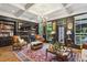 Elegant living room with a fireplace, bookshelves, and refined decor at 2442 Crescent Park Ct, Atlanta, GA 30339