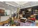 Inviting living room with fireplace, custom built-ins, and a stunning chandelier at 2442 Crescent Park Ct, Atlanta, GA 30339