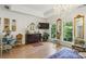 Bright main bedroom with large windows, hardwood floors, and tray ceilings at 2442 Crescent Park Ct, Atlanta, GA 30339