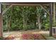 Back patio showcasing the privacy of a wooden trellis and the shade of mature trees at 2442 Crescent Park Ct, Atlanta, GA 30339