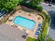 Aerial view of community pool surrounded by lounge chairs and manicured landscaping at 2442 Crescent Park Ct, Atlanta, GA 30339