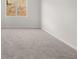 Large bedroom with plush carpet and views to a front yard at 109 Crooked Lake Park, Villa Rica, GA 30180