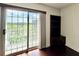 Balcony view showing a sliding glass door, green trees, and shelving at 199 14Th Street Ne St # 704, Atlanta, GA 30309