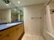 Well-lit bathroom with a large mirror above the vanity, and a bathtub with a shower curtain at 199 14Th Street Ne St # 704, Atlanta, GA 30309
