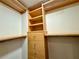 Spacious walk-in closet with built-in shelving and wooden drawers at 199 14Th Street Ne St # 704, Atlanta, GA 30309
