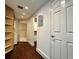 Hallway view leading to closet, a white door, and hard wood floors at 199 14Th Street Ne St # 704, Atlanta, GA 30309