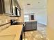 Open kitchen with island, view to living area, and modern appliances at 199 14Th Street Ne St # 704, Atlanta, GA 30309