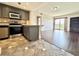 Modern kitchen flows into living area with tile and hardwood floors at 199 14Th Street Ne St # 704, Atlanta, GA 30309