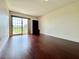 Bright living room featuring wood floors, balcony access, and built in storage at 199 14Th Street Ne St # 704, Atlanta, GA 30309