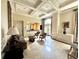Elegant lobby area with coffered ceilings, tiled floors, seating arrangements, and ample natural light at 199 14Th Street Ne St # 704, Atlanta, GA 30309