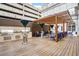 Modern outdoor kitchen featuring stainless steel grills, stone countertops, and a covered dining area at 199 14Th Street Ne St # 704, Atlanta, GA 30309