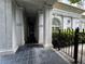 Covered walkway along a classic building exterior, featuring elegant columns and decorative ironwork at 199 14Th Street Ne St # 704, Atlanta, GA 30309
