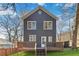 Exterior backyard view featuring a deck, blue siding, and plentiful light at 2395 Saint James Nw Dr, Atlanta, GA 30318