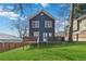 Exterior backyard view featuring a deck, lush green yard, and plentiful light at 2395 Saint James Nw Dr, Atlanta, GA 30318