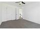 This bedroom has neutral carpet, white walls and trim, and a ceiling fan at 2395 Saint James Nw Dr, Atlanta, GA 30318