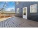 Wood deck attached to a home with blue siding and a white door at 2395 Saint James Nw Dr, Atlanta, GA 30318