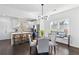 Open concept kitchen with stainless steel appliances, white cabinetry, and a large center island at 2395 Saint James Nw Dr, Atlanta, GA 30318