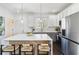 Bright kitchen with an island, a breakfast bar, white cabinets, and stainless appliances at 2395 Saint James Nw Dr, Atlanta, GA 30318