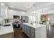 Kitchen featuring white cabinets, grey lower cabinets, and stainless steel appliances at 2395 Saint James Nw Dr, Atlanta, GA 30318