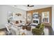 Bright living room features a fireplace, modern ceiling fan, wood slat accent wall, and stylish decor at 2395 Saint James Nw Dr, Atlanta, GA 30318