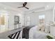 Spacious main bedroom with a tray ceiling, ceiling fan, decorative rug, and access to a bathroom and deck at 2395 Saint James Nw Dr, Atlanta, GA 30318