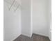The walk-in closet offers ample storage with wire shelving and grey carpet at 2395 Saint James Nw Dr, Atlanta, GA 30318