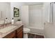 Bathroom featuring a vanity with granite countertop and a shower-tub combo at 2695 Trotters Walk Trl, Snellville, GA 30078