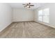 Bright bedroom with neutral carpet, large windows, and ample natural light at 2695 Trotters Walk Trl, Snellville, GA 30078