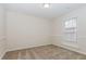 This bedroom features neutral walls, carpet, and a bright window at 2695 Trotters Walk Trl, Snellville, GA 30078