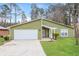 Charming one-story home with green siding, white trim, and well-maintained front yard at 2695 Trotters Walk Trl, Snellville, GA 30078