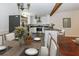 Modern kitchen with stainless steel appliances, island seating, and hardwood floors at 2695 Trotters Walk Trl, Snellville, GA 30078