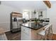 Stylish kitchen with stainless steel appliances, an island, and elegant lighting at 2695 Trotters Walk Trl, Snellville, GA 30078