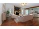 Elegant living room with hardwood floors and a stylish stone fireplace at 2695 Trotters Walk Trl, Snellville, GA 30078