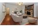 Comfortable living room with hardwood floors and a cozy stone fireplace at 2695 Trotters Walk Trl, Snellville, GA 30078