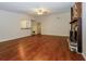 Spacious living room with hardwood floors, a stone fireplace, and natural light at 2695 Trotters Walk Trl, Snellville, GA 30078